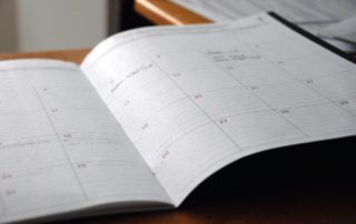 a close up of a planner calendar book