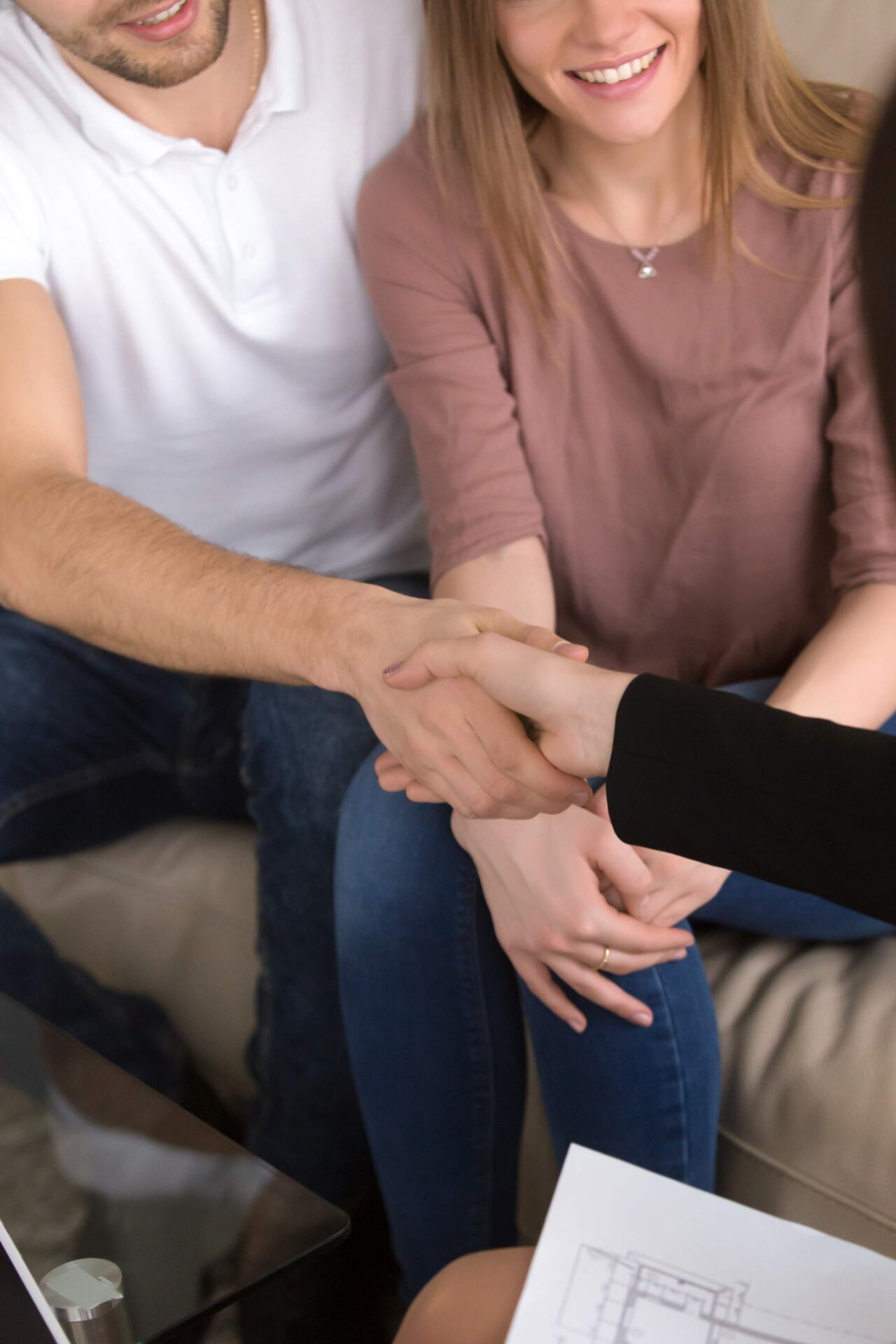 jpeg-optimizer_couple-shaking-hands-with-realtor-real-estate-home-renovation